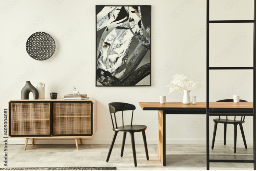 Salon appartement moderne style scandinave commode en bois table et chaises design tableau peinture abstraite sur le mur