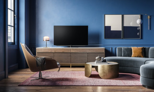 Salon design avec canapé angle arrondi fauteuil confort meuble tv table basse métal