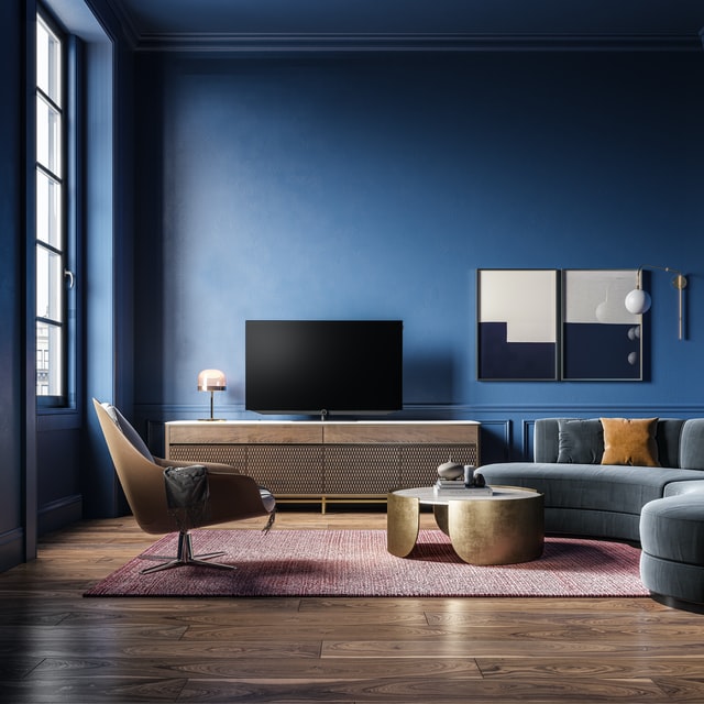 Salon design avec canapé angle arrondi fauteuil confort meuble tv table basse metal